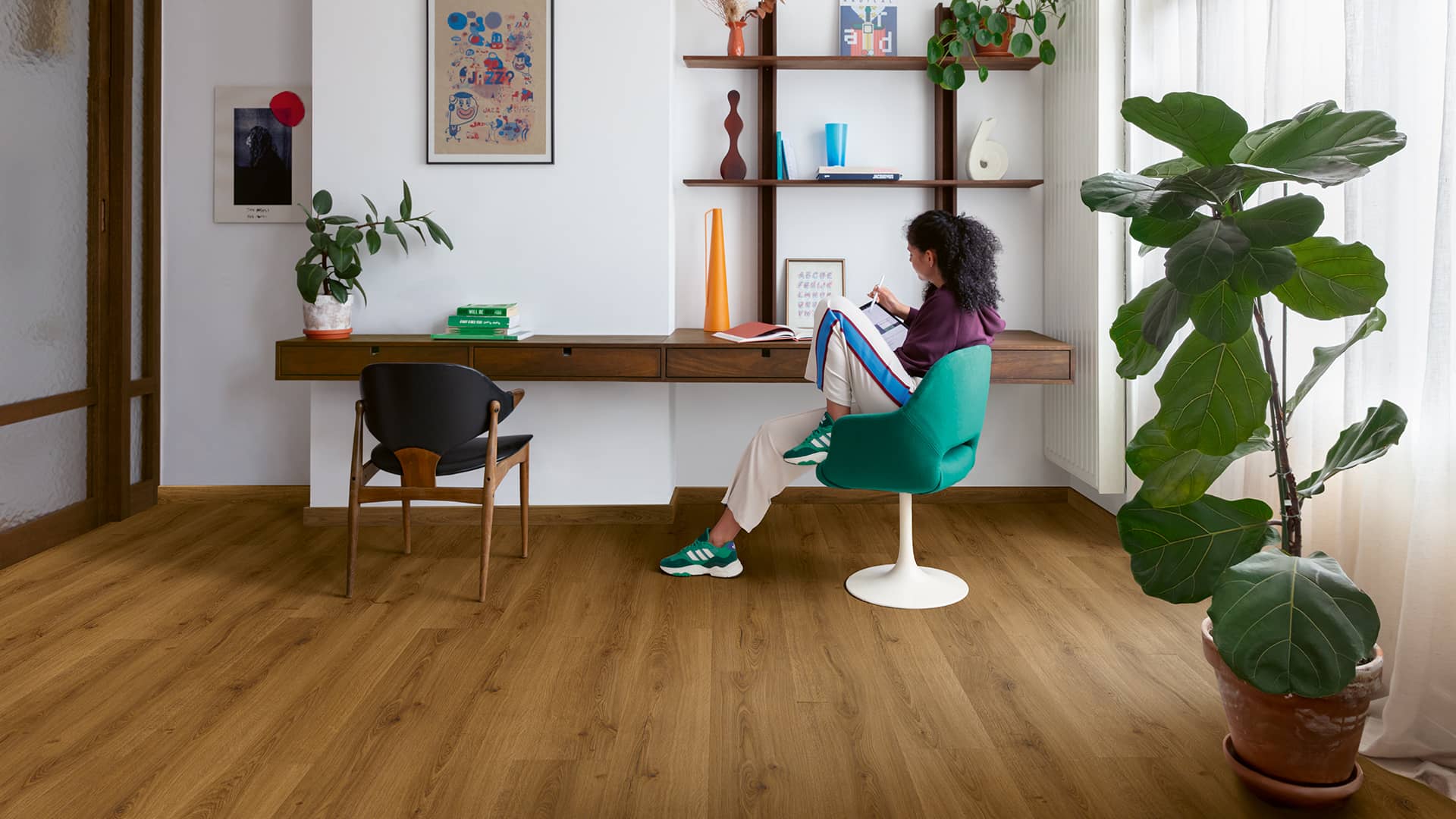 Home office with brown vinyl plank floor